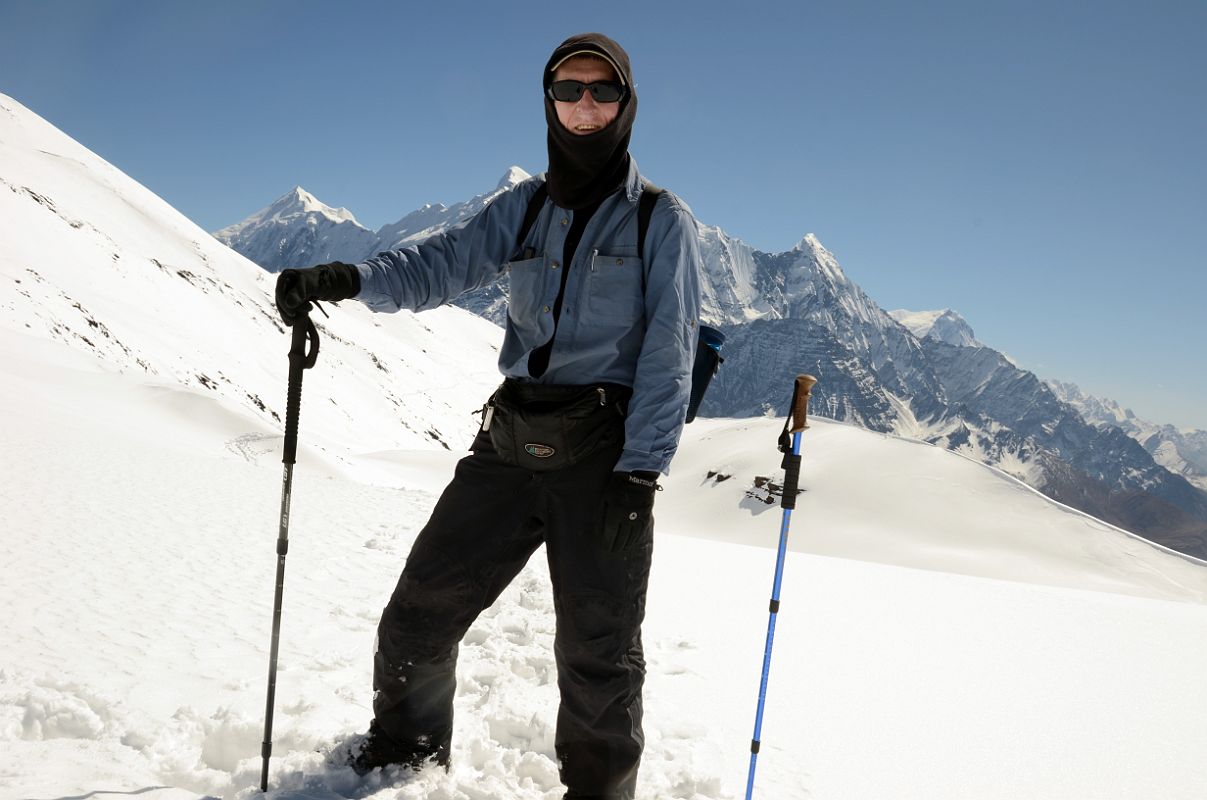 11 Jerome Ryan Trekking In The Snow With Tilicho Peak, Nilgiri, and Annapurna South Behind On Trail From Top Of Ridge Above Yak Kharka Towards Kalopani Around Dhaulagiri 